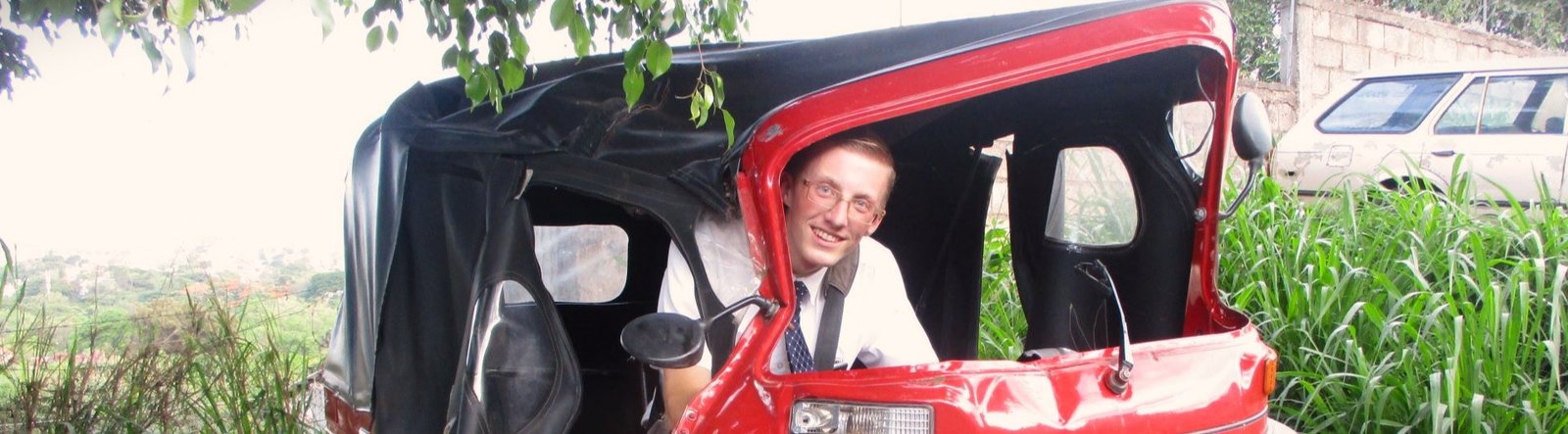 page hero, Landon in a mototaxi
