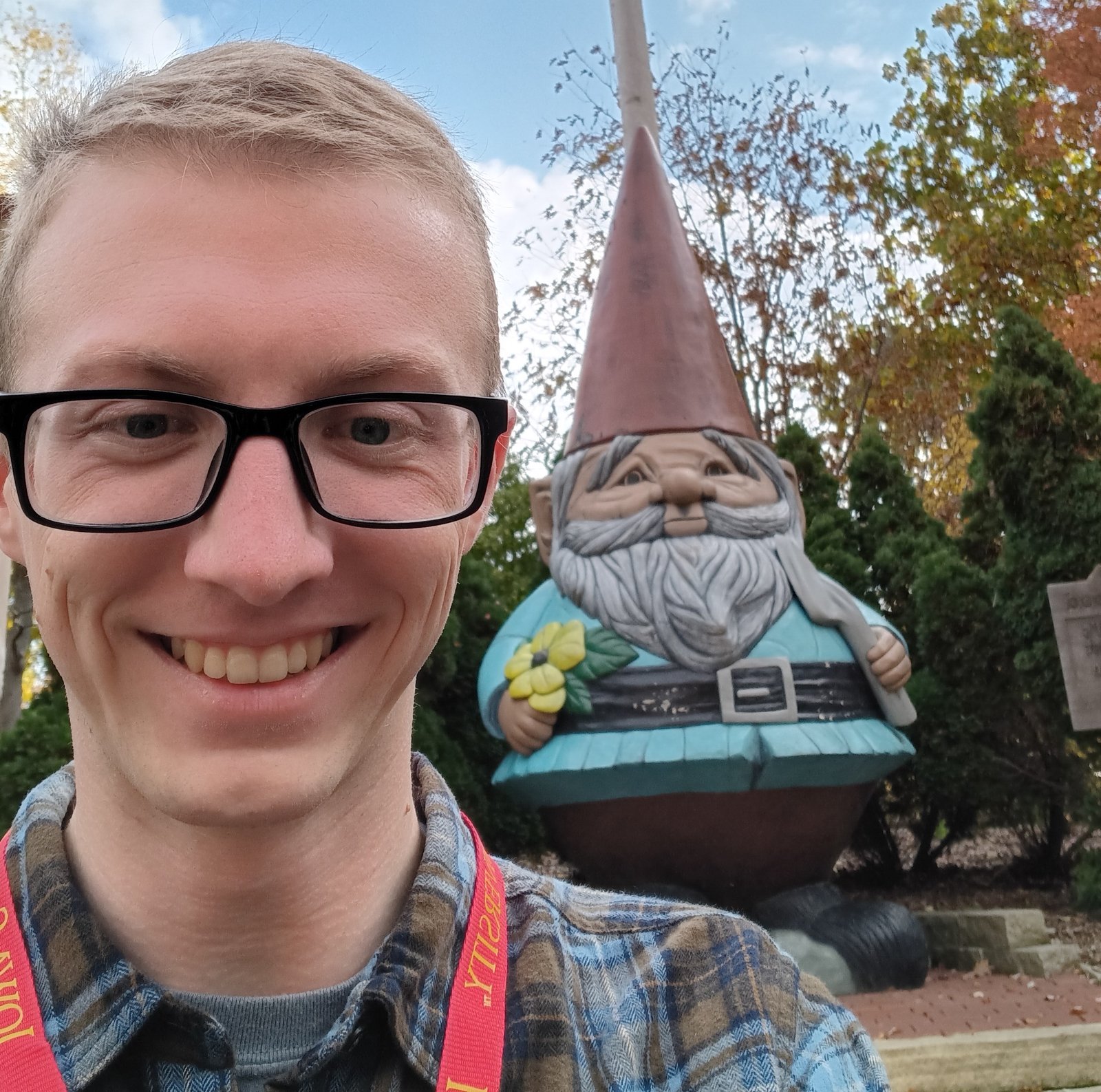 Landon in front of a giant gnome in Iowa