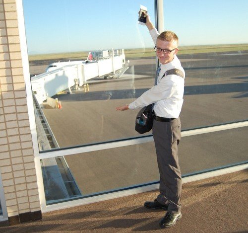 Landon pointing to his plane