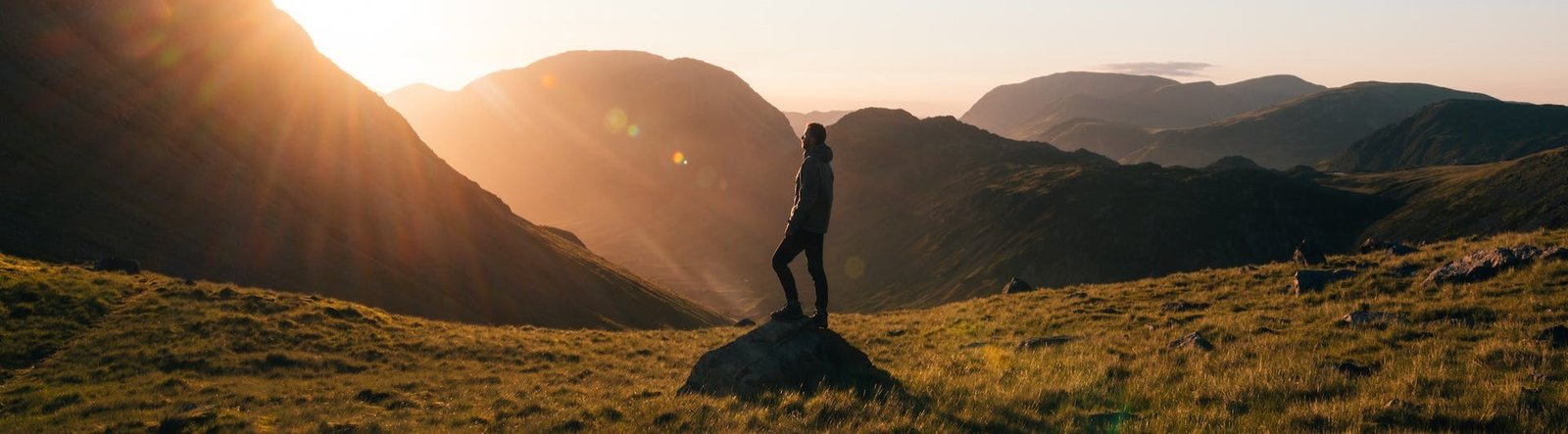 A man standing on a rock outdoors