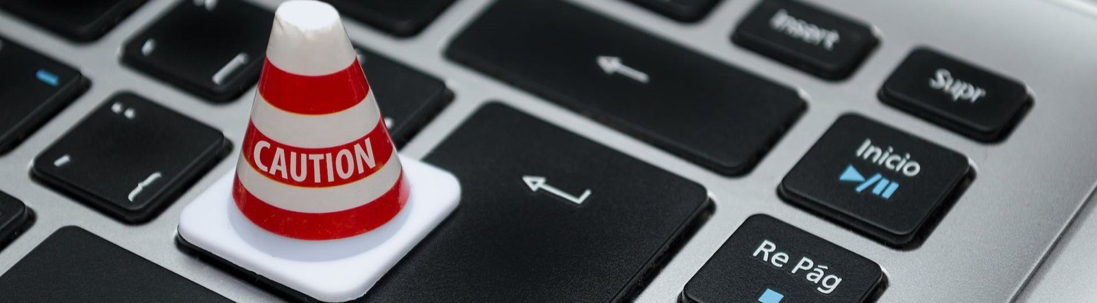 A caution sign on a keyboard